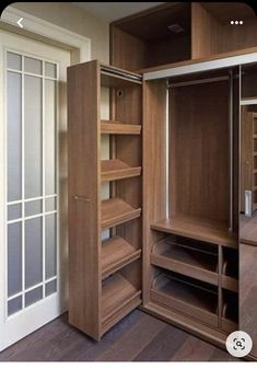 an open closet with shelves and sliding doors