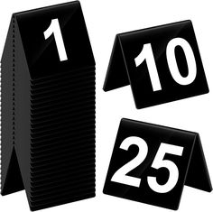 two black calendars with the number twenty five and twenty seven on each one side