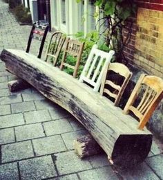 some chairs are sitting on a wooden bench