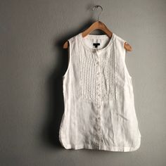 New With Tags, 100% Linen. Bust 36” Length 25.5”. This Is Not A True White, But Not Cream, More What I Would Call Off-White White Buttoned Tank Top, White Sleeveless Buttoned Top, White Sleeveless Top With Buttons, White Tank Top With Buttons, Sleeveless Linen Top With Buttons, White Buttoned Tank Top For Work, Sleeveless Linen Top With Button Closure, Sleeveless Linen Tank Top With Button Closure, Casual Daywear Vest With Buttons