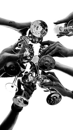 a group of people holding wine glasses together