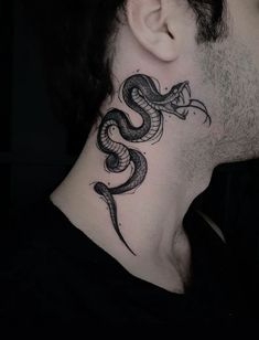 a man's neck with a snake tattoo on it