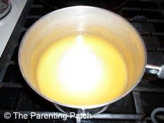 a pan on the stove is full of yellow liquid