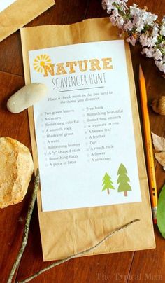 the nature scavenger hunt is set out on a table with flowers, rocks and pencils