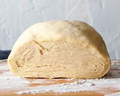 a loaf of bread sitting on top of a wooden table