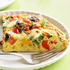 a slice of quiche on a plate with a fork