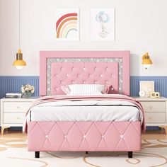 a pink bed sitting in a bedroom on top of a hard wood floor next to a white dresser