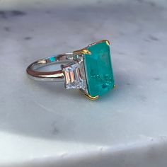 New in! Gorgeous emerald cut paraiba stone ring with trapezoid cz diamond sides, made from sterling silver & 18k gold plated prongs Sku GAR0325 Cz Diamond, Stone Ring, Sterling Ring, Emerald Cut, Stone Rings, Beautiful Rings, Sterling Silver Rings, Jewelry Accessories, 18k Gold