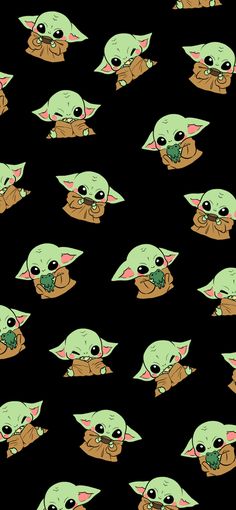 the baby yoda is eating something with his hands and eyes open, while it's surrounded by smaller green faces