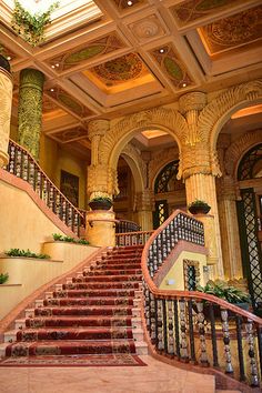 an ornate staircase leading up to the second floor