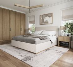 a large bed sitting on top of a wooden floor next to a dresser and mirror