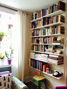 a living room filled with lots of books