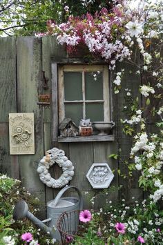 an old shed with flowers and other things on the outside, as seen on instagram