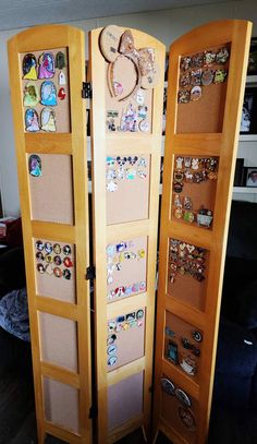 an open wooden door with lots of magnets on it