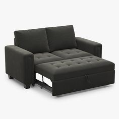 a black couch sitting on top of a white floor