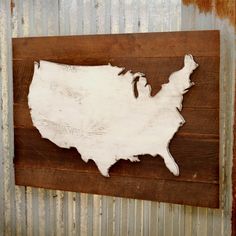 the united states is made out of wood and has been painted white on an old metal wall