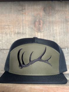 This is a vented solid back 7 panel snap back hat. Army green embroidery  Elk shed design One size fits most copyright ©️ A. Vigil 2018 all rights reserved Green 5-panel Trucker Hat For Outdoor, Green Outdoor Fitted Hat, Green Fitted Hat For Outdoor, Green Flat Bill Baseball Cap For Outdoor Activities, Green Flat Bill Baseball Cap For Outdoor, Green 5-panel Trucker Hat For Outdoor Activities, Outdoor Snapback Hat With Curved Bill, Green Trucker Hat With Flat Bill For Outdoor, Green Trucker Snapback Hat For Outdoor