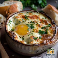 an egg dish in a bowl with bread and parsley on the side for garnish