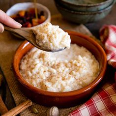 a spoon full of oatmeal in a bowl