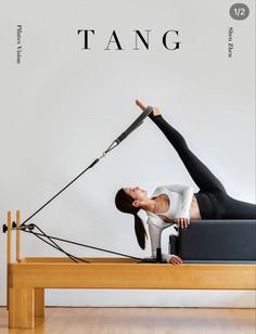 a woman is doing yoga on a bench with the words tang in front of her