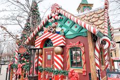 a house decorated for christmas with candy canes and gingerbread decorations on the roof