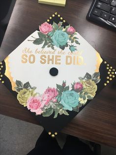 a decorated graduation cap sitting on top of a desk