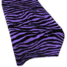 a purple and black zebra print table runner