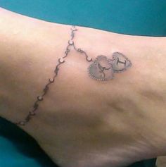 a person with a tattoo on their foot that has an elephant and hearts drawn on it