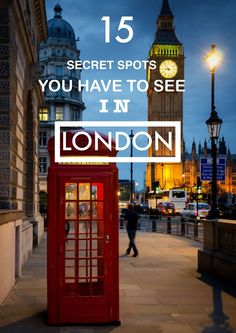 a red phone booth sitting on the side of a street next to a clock tower