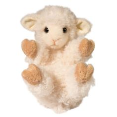 a stuffed sheep is hanging upside down on its back with one foot up and two hands in the air