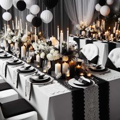 a long table is set with black and white decorations