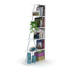 a tall white shelf with books and magazines on it's sides, next to a potted plant