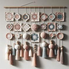 there are many crocheted ornaments hanging on the wall