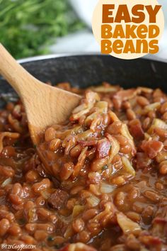 a wooden spoon stirring baked beans in a skillet with the words easy baked beans above it