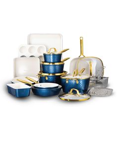 blue and white dishes with gold rims