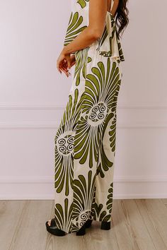 - Indulge yourself in luxe vibes with these sleek and stylish pants! - Material with an abstract print and a satin finish - Built-in shorts style lining - A waistline with an elastic back, a hidden zip fly, and double hook and eye closure - Functional side pockets - A relaxed silhouette that ends in wide hemlines Chic Olive Summer Pants, Chic Olive Bottoms For Spring, Chic Green Bottoms With Elastic Waistband, Chic Abstract Print Pants For Spring, Summer Wide Leg Bottoms With Abstract Print, Chic Olive Bottoms For Summer, Wide Leg Bottoms With Abstract Print For Summer, Green Printed Bottoms For Day Out, Chic Green Printed Bottoms