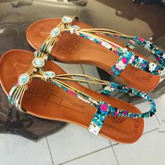 Turquoise And Gold Multicolor Back Strap Sandals . These Embellished Sandles Have An Elastic Floral Back Strap , Light Turquoise Jewels With Gold Piped Straps Across The Toes. Gold Piped Foot Straps , Extra Comfy Footbed Excellent Quality Brand New Without Tags. Never Been Worn . Size 8 Bohemian Embellished Sandals For The Beach, Bohemian Embellished Beach Sandals, Turquoise Open Toe Sandals For Vacation, Blue Beaded Sandals For Vacation, Turquoise Open Toe Bohemian Sandals, Multicolor Embellished Bohemian Sandals, Bohemian Multicolor Embellished Sandals, Turquoise And Gold, Fancy Shoes