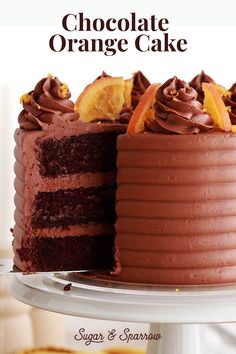 there is a chocolate cake with oranges on it and the words, chocolate orange cake