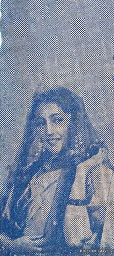 an old photo of two women sitting next to each other in front of a blue background