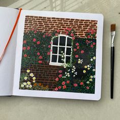 an open book with a drawing of a brick building and flowers on the outside wall