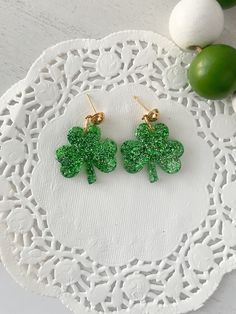 Need something cute for St. Patrick's Day? Get yourself some shamrock earrings! 🍀🍀 Listing includes: 1 pair of shamrock earrings handcrafted from resin & glitter. NO RETURNS OR EXCHANGES  QUESTIONS? Let me know! St Patricks Day Earrings, St. Patrick’s Day, Shamrock Earrings, Resin Glitter, Saint Patrick, St Patricks, St Patrick, St Patricks Day, Favorite Jewelry