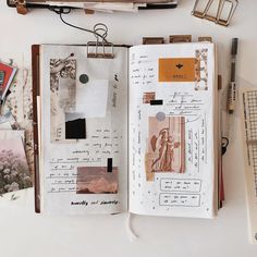 an open book with pictures and other things on top of it, sitting on a table