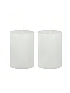 two white candles sitting next to each other