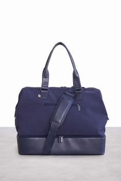 Navy Weekender Bag Functional Duffle Bag With Removable Pouch For On-the-go, Modern Gym Bag With Luggage Sleeve For Weekend Trips, Functional Tote Luggage With Removable Pouch, Functional Tote Travel Accessories With Removable Pouch, Functional Travel Tote With Removable Pouch, Functional Travel Bag With Removable Pouch For Weekend Trips, Functional Tote Duffle Bag For Daily Use, Functional Tote Shoulder Bag For Overnight Trips, Functional Tote Travel Bag For Daily Use