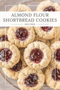 almond flour shortbread cookies with raspberry jam on top and the words almond flour shortbread cookies