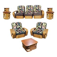 a set of four chairs and two end tables with matching upholstered cushions on them