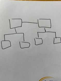 a piece of paper that has been drawn onto with black marker on it and some squares in the middle