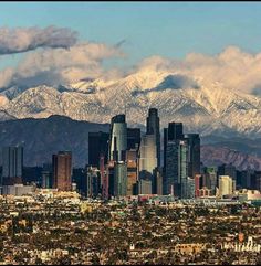 the city is surrounded by snow capped mountains