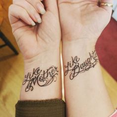 two people with matching wrist tattoos that say like mother, like daughter