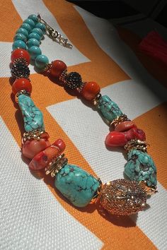 ☑️Natural turquoise and red coral are used in our product. ☑️Since it is suitable for scratching due to its stone structure, it should be kept away from hard contacts and stored in velvet bags/boxes. ☑️Max length is 24cm. ☑️The pendant is gold plated over bronze. ☑️The pendant is in the shape of a round and there are zircon stones in detail. ☑️The product should be kept away from chemicals such as perfume, deodorant, sunscreen and should not come into contact with water. ☑️I recommend that the p Red Bohemian Beaded Necklaces With Stones, Bohemian Red Beaded Necklaces With Stones, Unique Red Stone Necklaces, Bohemian Turquoise Beaded Necklaces In Red Coral, Bohemian Red Coral Beaded Necklace In Turquoise, Bohemian Turquoise Necklace With Red Coral For Gift, Bohemian Turquoise And Red Coral Beaded Necklaces, Bohemian Turquoise Beaded Necklace With Red Coral, Bohemian Multicolor Jewelry With Red Coral